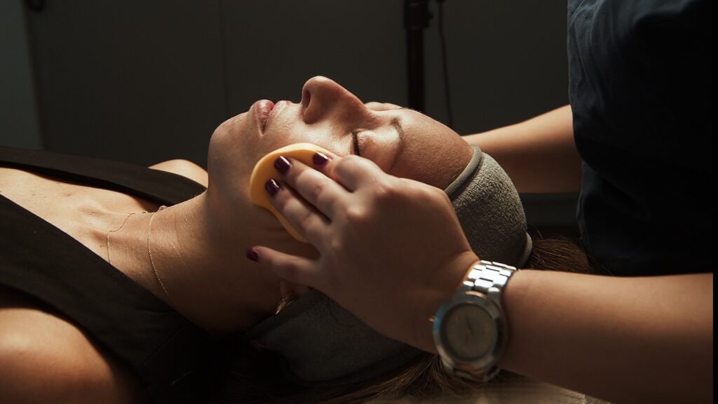 Aesthetic clinic video production showcasing treatment room and professional medical environment. Cinematic visuals of aesthetic clinic interior and patient treatment setup. Doctor performing aesthetic procedure captured in professional video production. Modern clinic environment filmed for promotional medical marketing vide